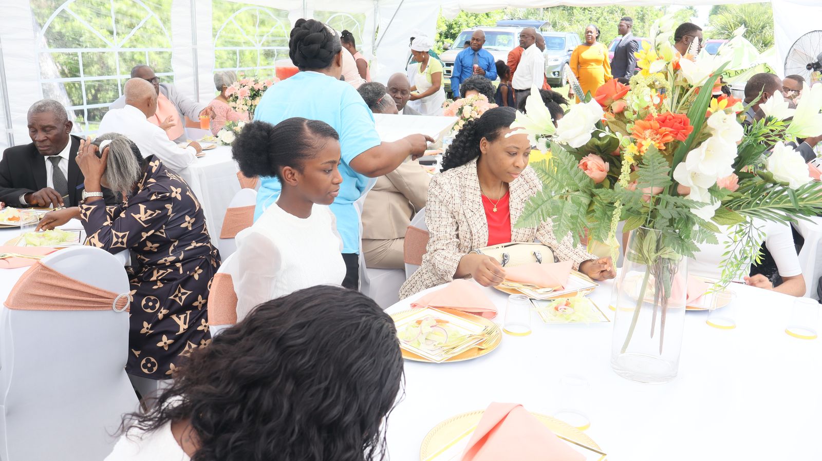 church members enjoying fellowship at an outdoor gathering 
